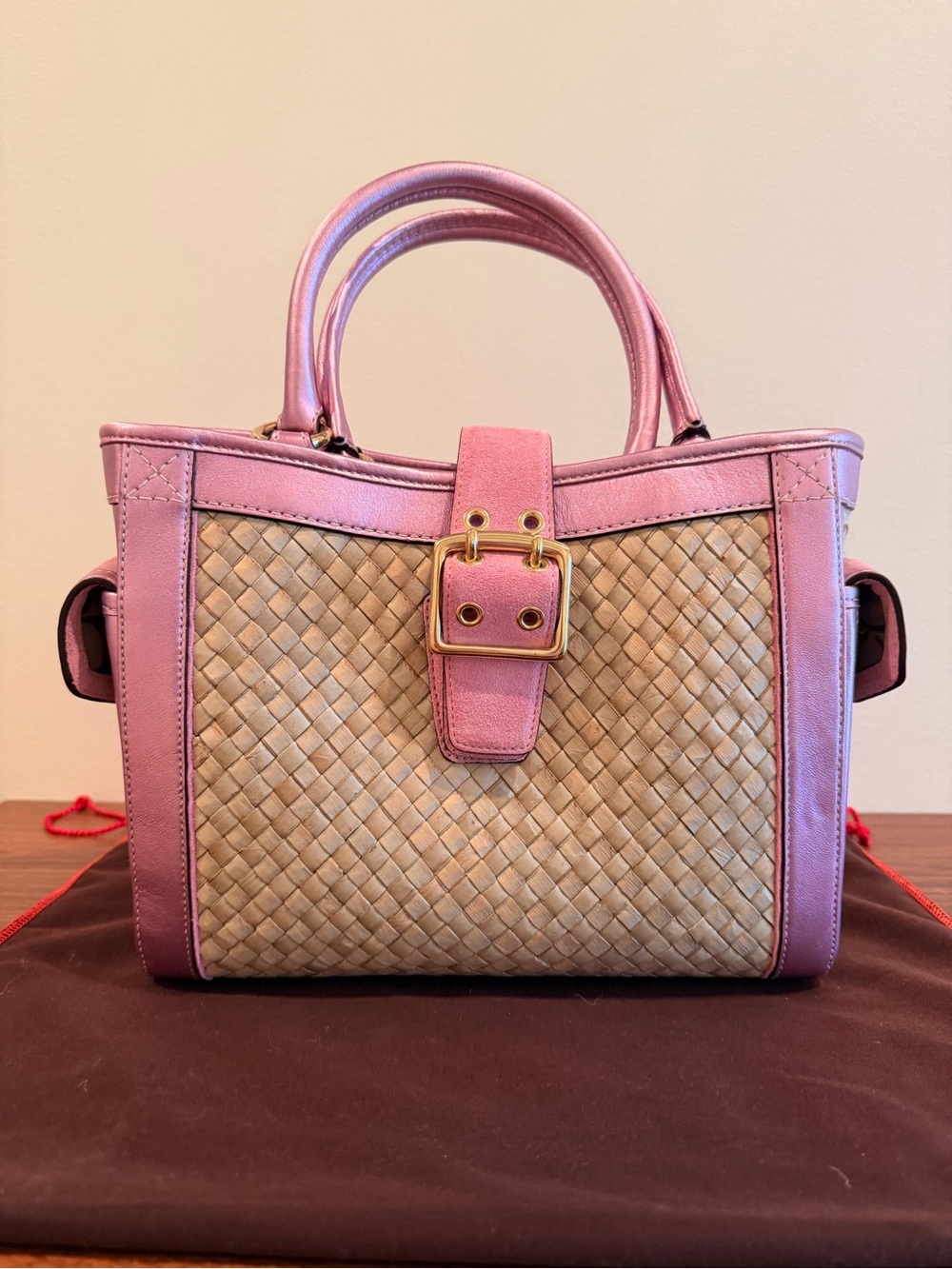 Coach vintage mid 2000s woven straw soho tote with coral pink suede trim.